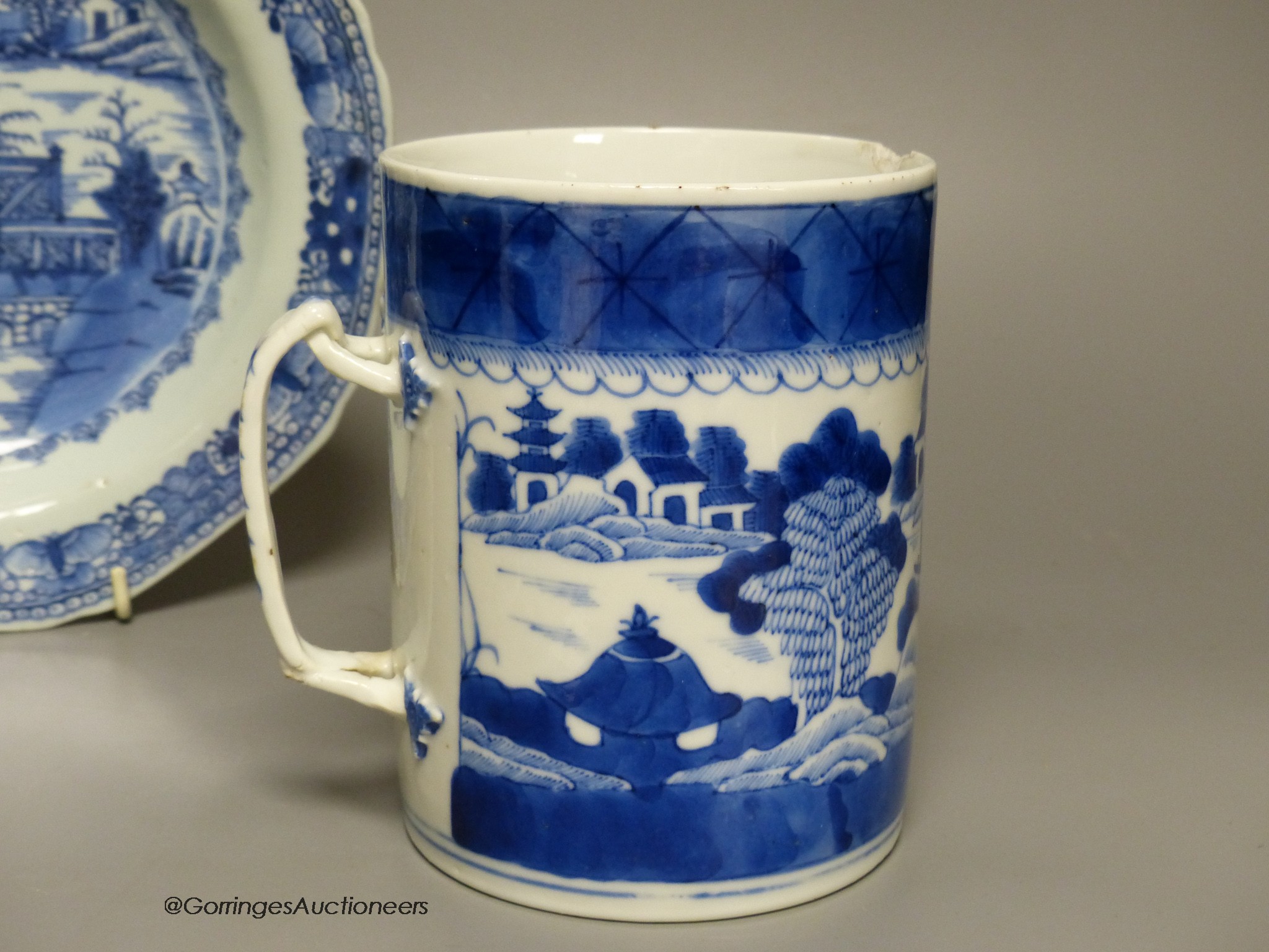 An 18th century Chinese blue and white mug, plate and saucer, largest 23cm diameter